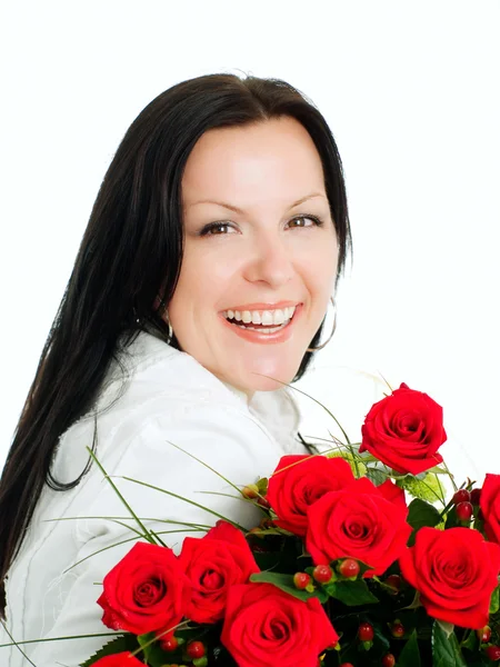 Femme brune souriante avec bouquet — Photo