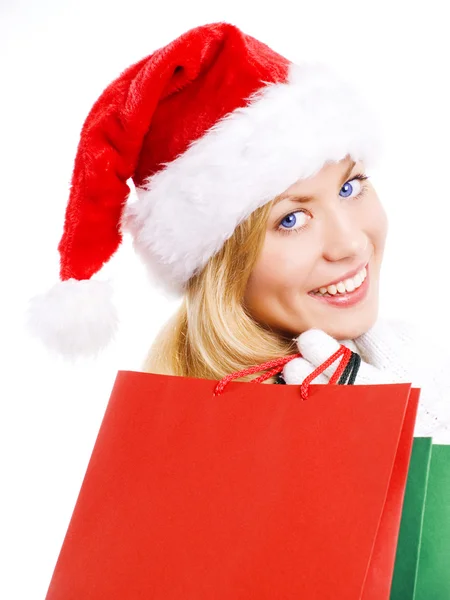 Рождественская женщина держит покупки — стоковое фото
