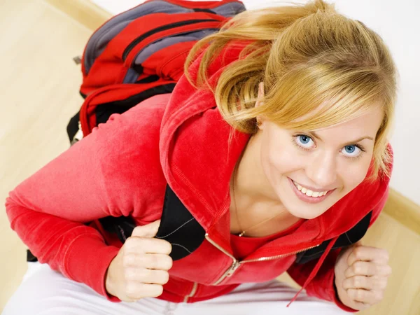 Teenager sitting with backpack — Stock Photo, Image