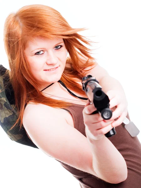 Red warrior girl holding gun over white — Stock Photo, Image