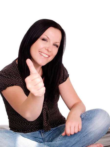 Brunette woman with her thumb up — Stock Photo, Image
