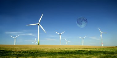 Wind turbines farm with high moon clipart