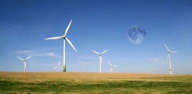 Wind turbines farm with full moon clipart