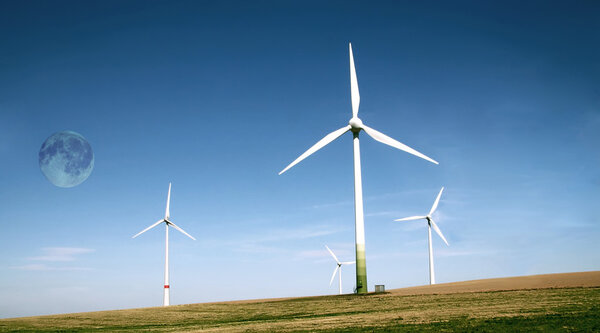 Wind turbines farm with high moon