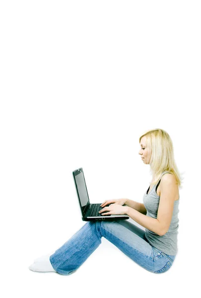 Laptop on knees — Stock Photo, Image