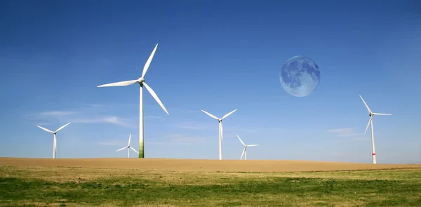 Wind turbines farm with full moon — Stock Photo, Image