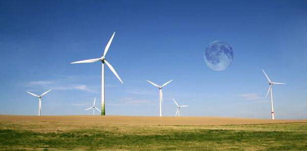 Wind turbines farm with full moon
