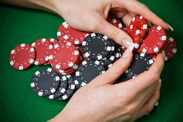 Poker player raking a big pile of chips — Stock Photo, Image