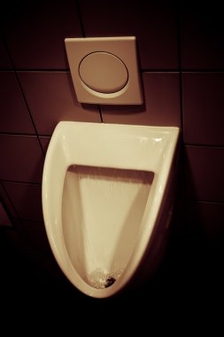 Clean urinal in men's public restroom clipart