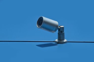 Security camera on wall outdoor clipart