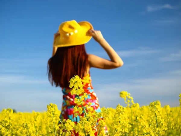 stock image Beautiful woman on field in bloom