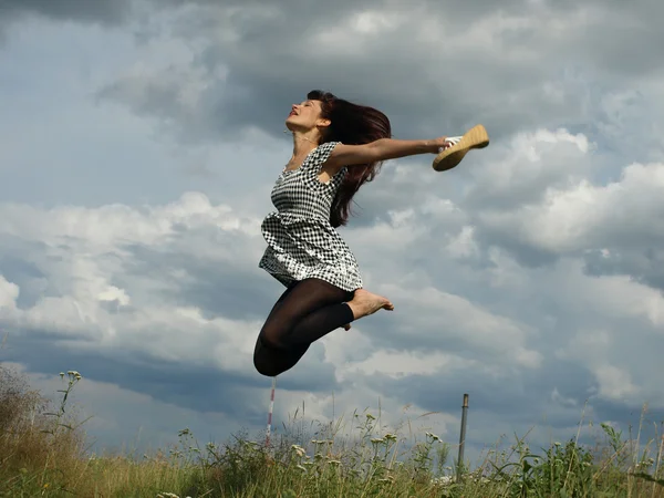 Very happy woman jumping pleasure odes — Stock Photo, Image