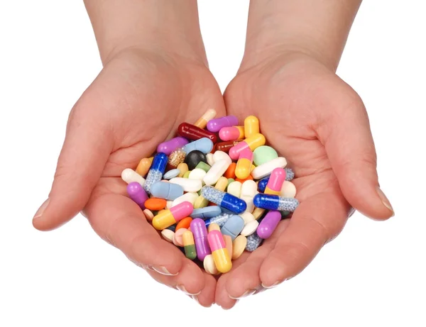 Händer med piller — Stockfoto