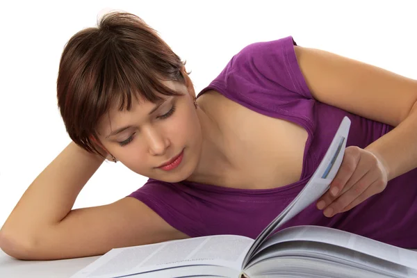 Young student reads the book — Stock Photo, Image
