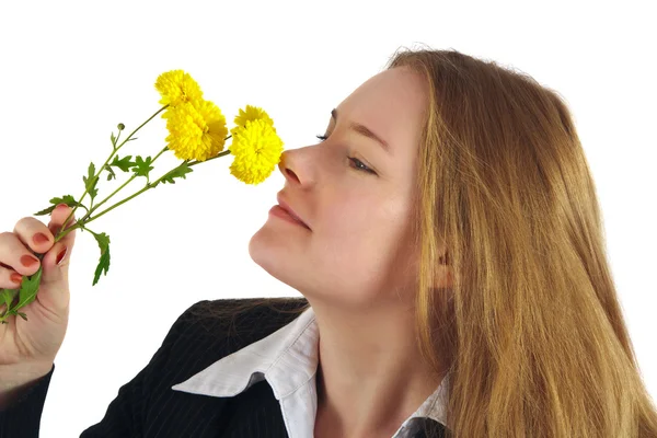 Woman smells yellow flowers — Stock Photo, Image