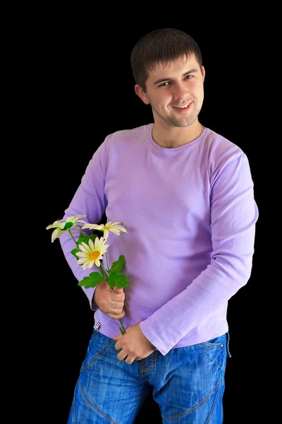 Man holds plastic flowers — Stock Photo, Image