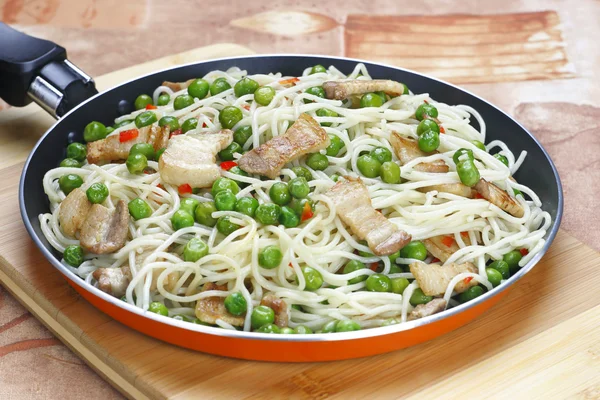 Pasta with peas and meat — Stock Photo, Image