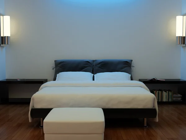 Interior de un dormitorio con una cama — Foto de Stock