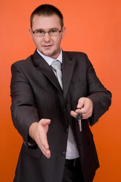 Businessman with keys — Stock Photo, Image