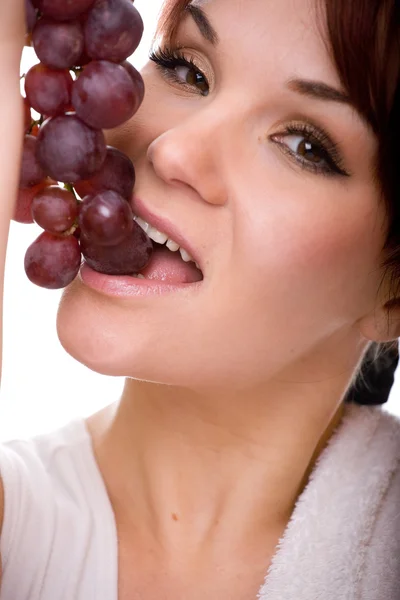 Vrouw met druiven — Stockfoto