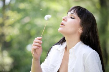 Woman with dandelion clipart