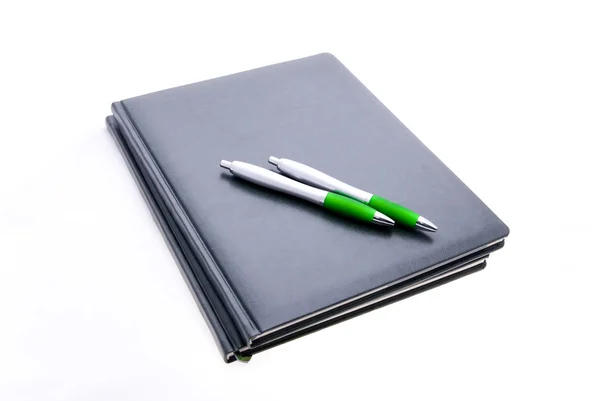 Notepads and pens isolated — Stock Photo, Image