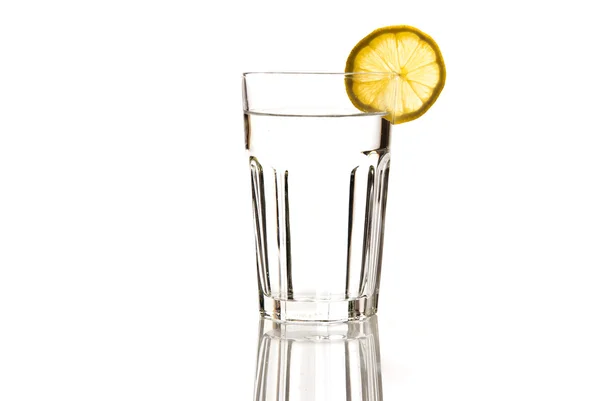 Glass of mineral water with lemon — Stock Photo, Image