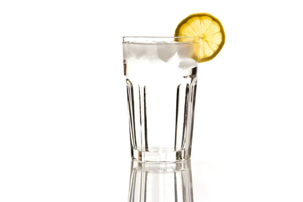 Glass of water with lemon and ice — Stock Photo, Image