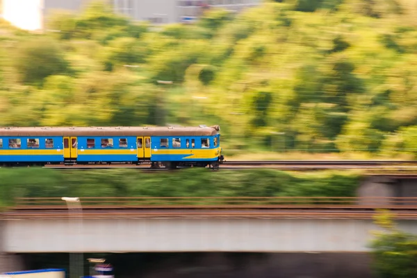 Blue and yellow fast electric train — Stock Photo, Image