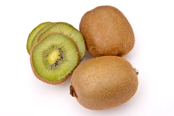 Kiwi cut to pieces and whole two — Stock Photo, Image
