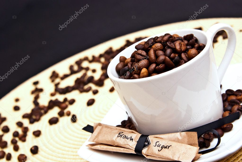 Coffee cup and beans with brown sugar