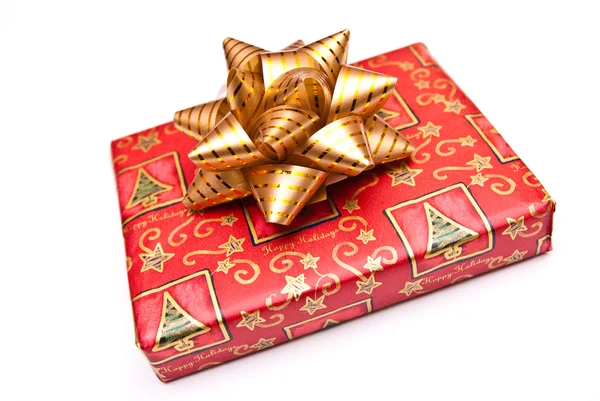 Christmas present with gold bow — Stock Photo, Image