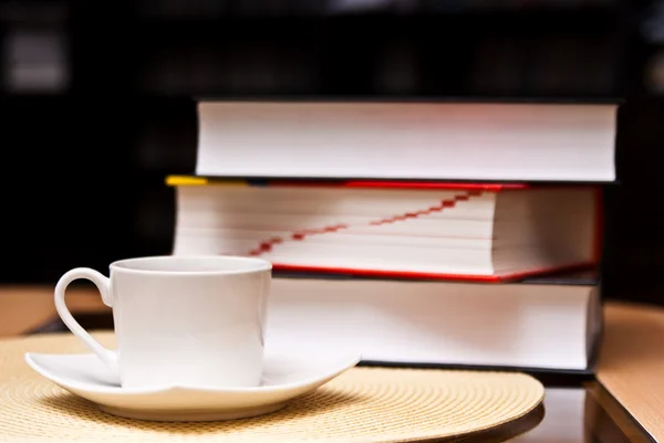 Cup of coffee and opened books — Stock Photo, Image