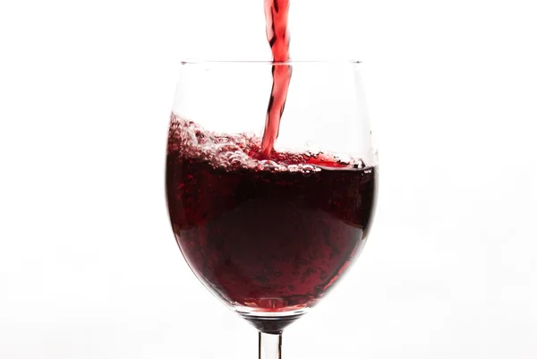 Red wine pouring wineglass — Stock Photo, Image