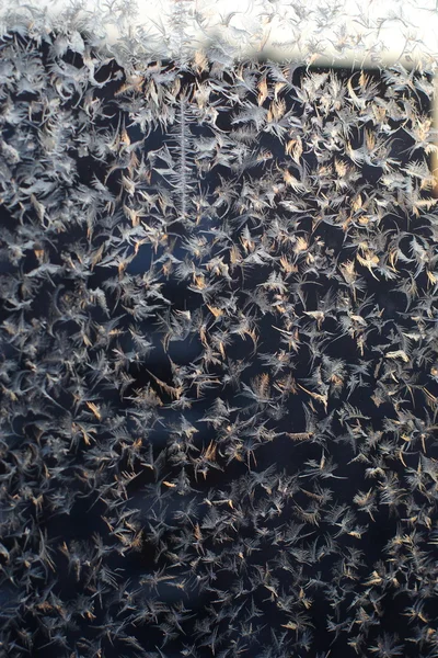 Frosty patterns at a window — Stock Photo, Image