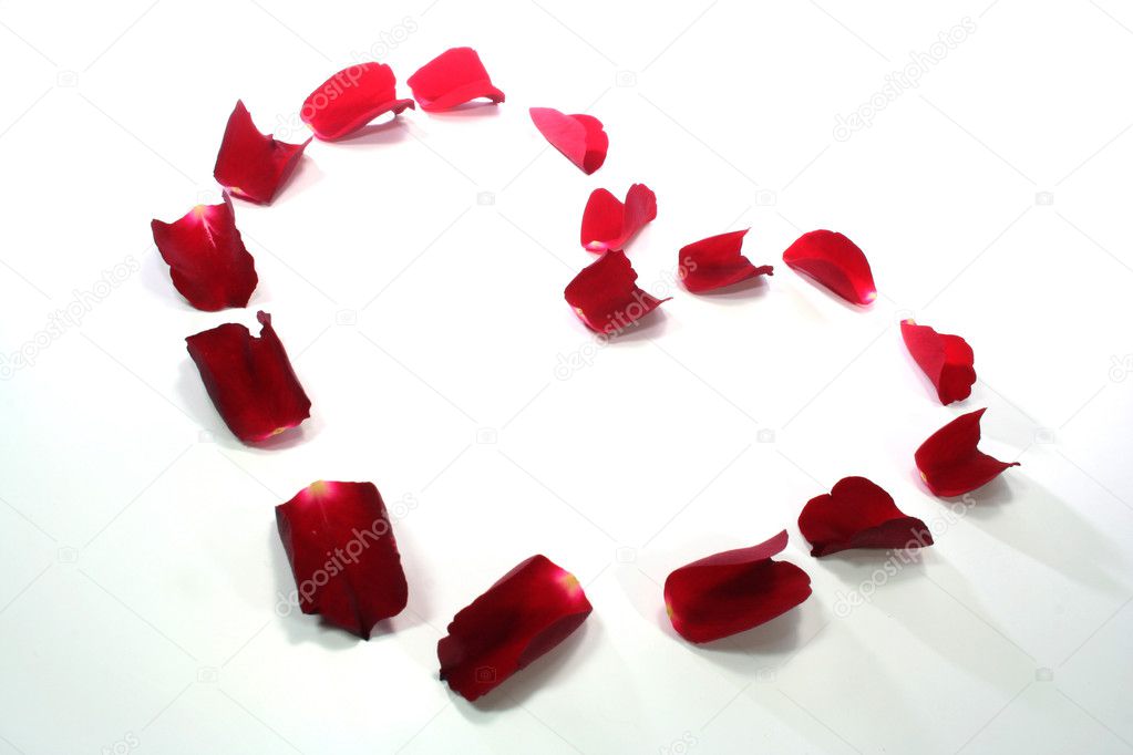 Heart of red rose petals as background Stock Photo by ©photooasis 2024944