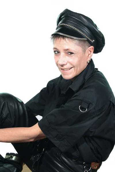 Stock image Young woman with a leather cap