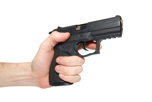 Pistola negra en una mano — Foto de Stock