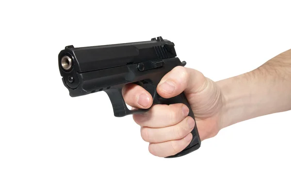 Pistola negra en una mano — Foto de Stock