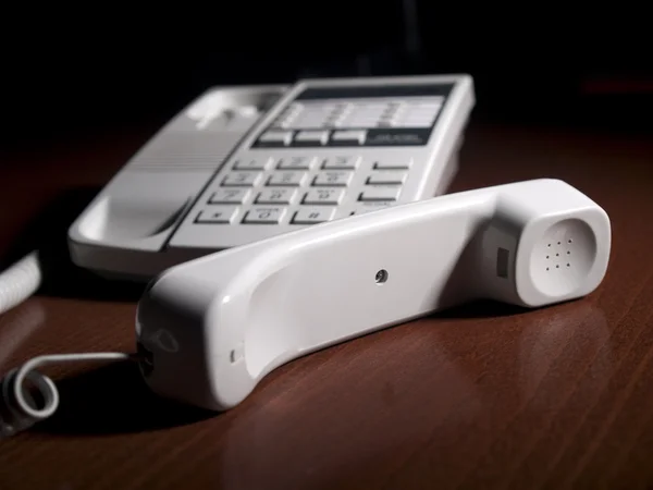 Telephone receiver and a phone — Stock Photo, Image