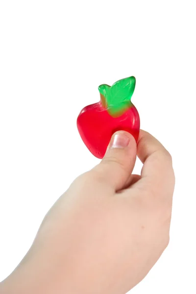 Dětská ruka drží ovocné bonbóny — Stock fotografie