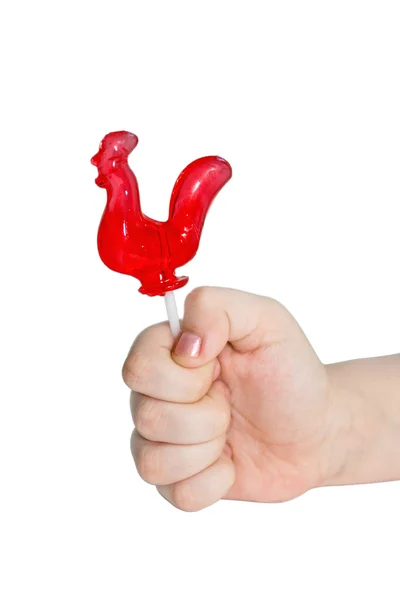 Barnens hand med lollipop — Stockfoto