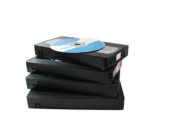 Відеокасети та DVD-диск — стокове фото