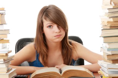 Girl studying at the desk being tired clipart