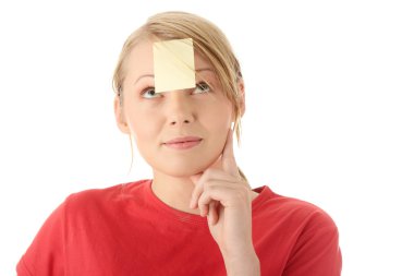 Yellow sticky note on forehead clipart