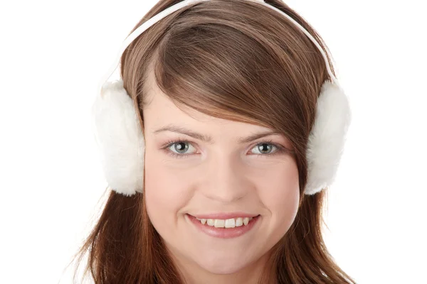 Pretty young teen girl wearing white earmuff — Stock Photo, Image