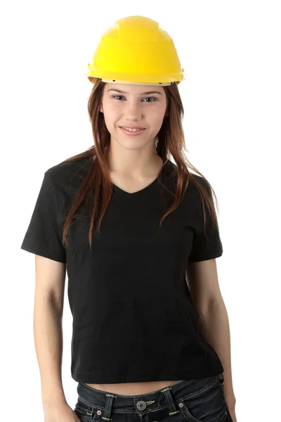 Инженерша в жёлтом шлеме — стоковое фото