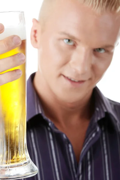Happy young man holding a glass of beer — Stock Photo, Image