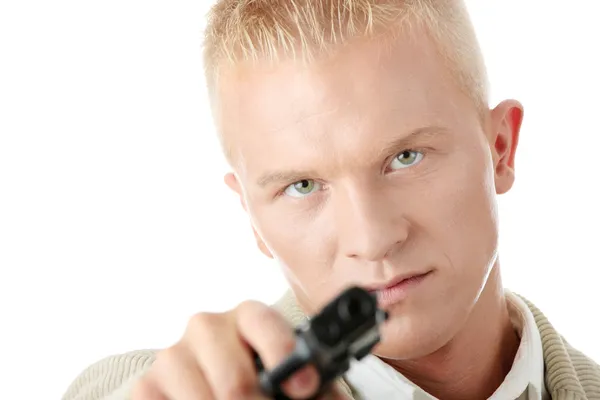 Young man aiming with pistol in hand — Stock Photo, Image