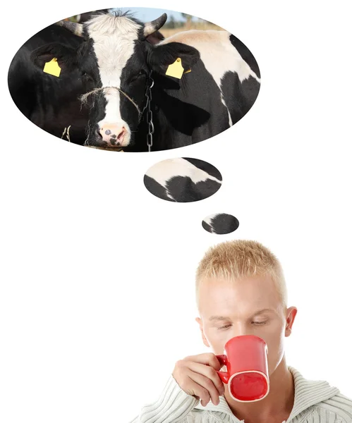 stock image Young caucasian man drinking milk.